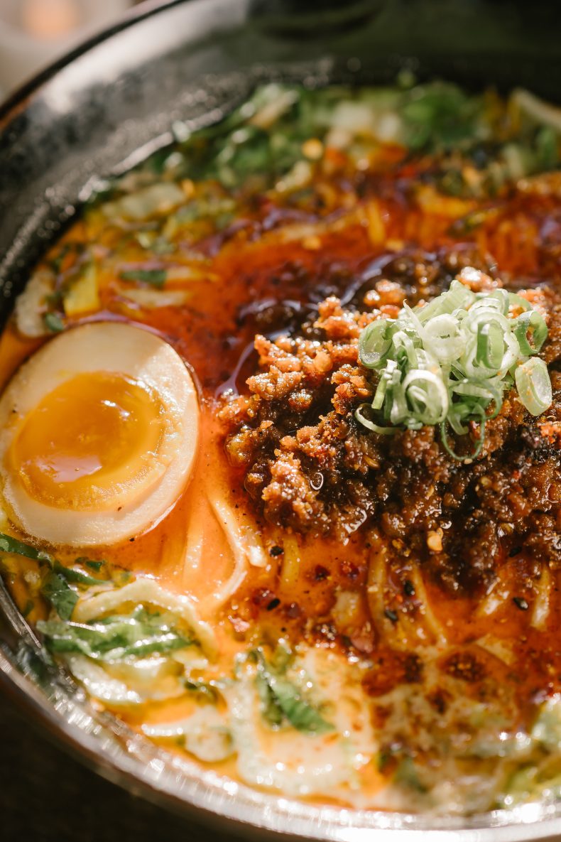 Spicy ramen with a jammy egg, ground pork and scallions